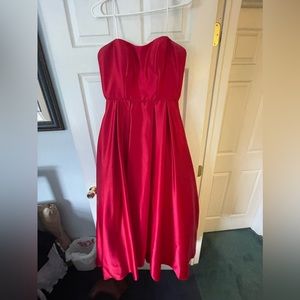 Red prom dress, strapless, has pockets